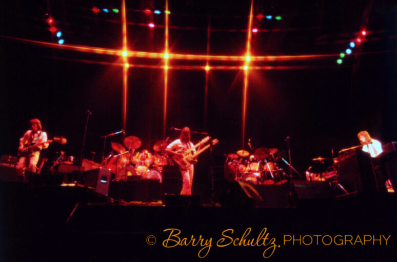 English rock band Genesis performing live on stage during the 1970s.