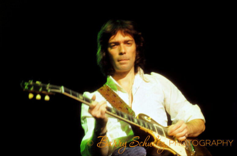 Classical guitarist Steve Hackett of the English rock band Genesis performing live on stage during the 1970s.