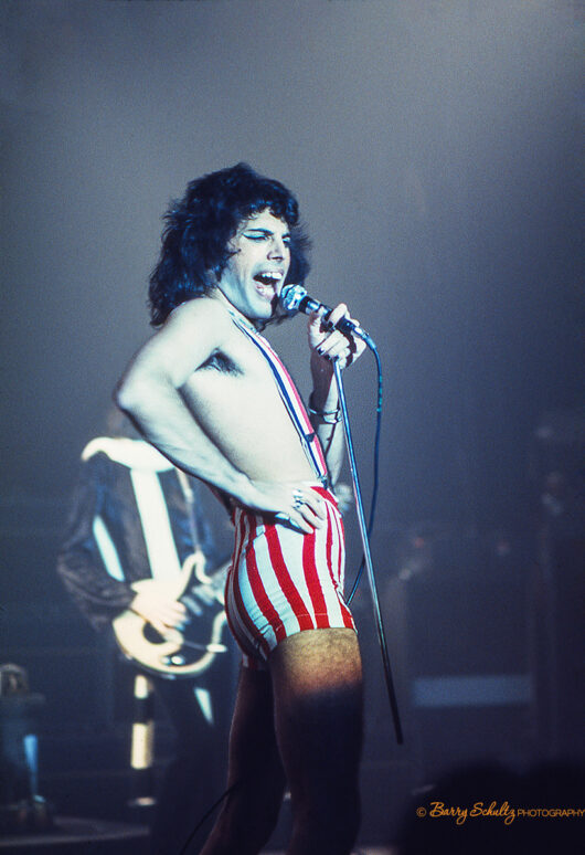 queen, barry schultz, freddie mercury, brian may, bohemian rhapsody, we will rock you, we are the champions, another one bites the dust, roger taylor, john deacon, red special, don't stop me now