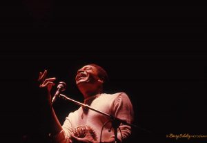 Colour photograph of singer and songwriter Al Jarreau performing live in Los Angeles at the Bla Bla Cafe, early 1970s.